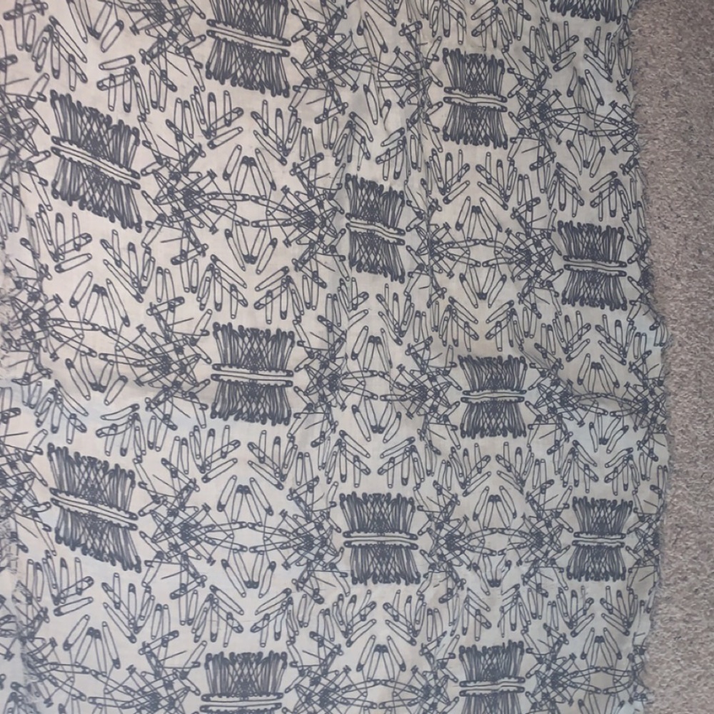 This scarf is lightweight, soft and goes great with neutrals!